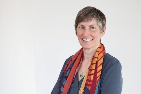 A headshot of Julie Harrison